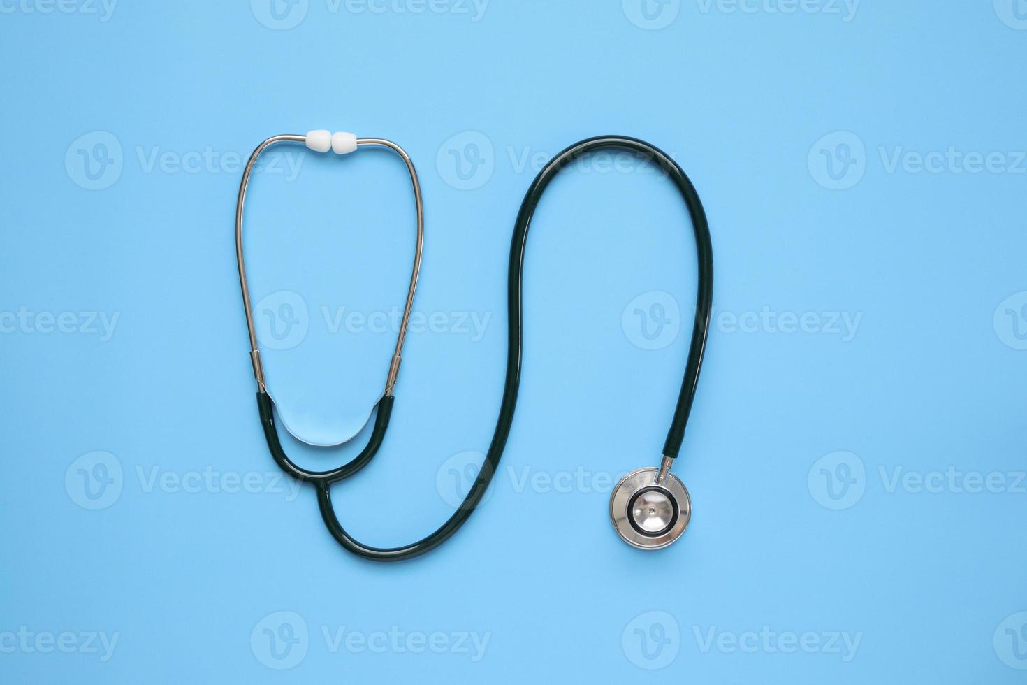 Stethoscope medical equipment on blue background healthcare concept photo