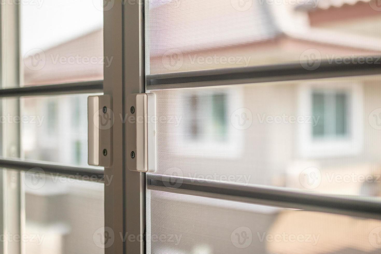 mosquito net wire screen on house window protection against insect photo