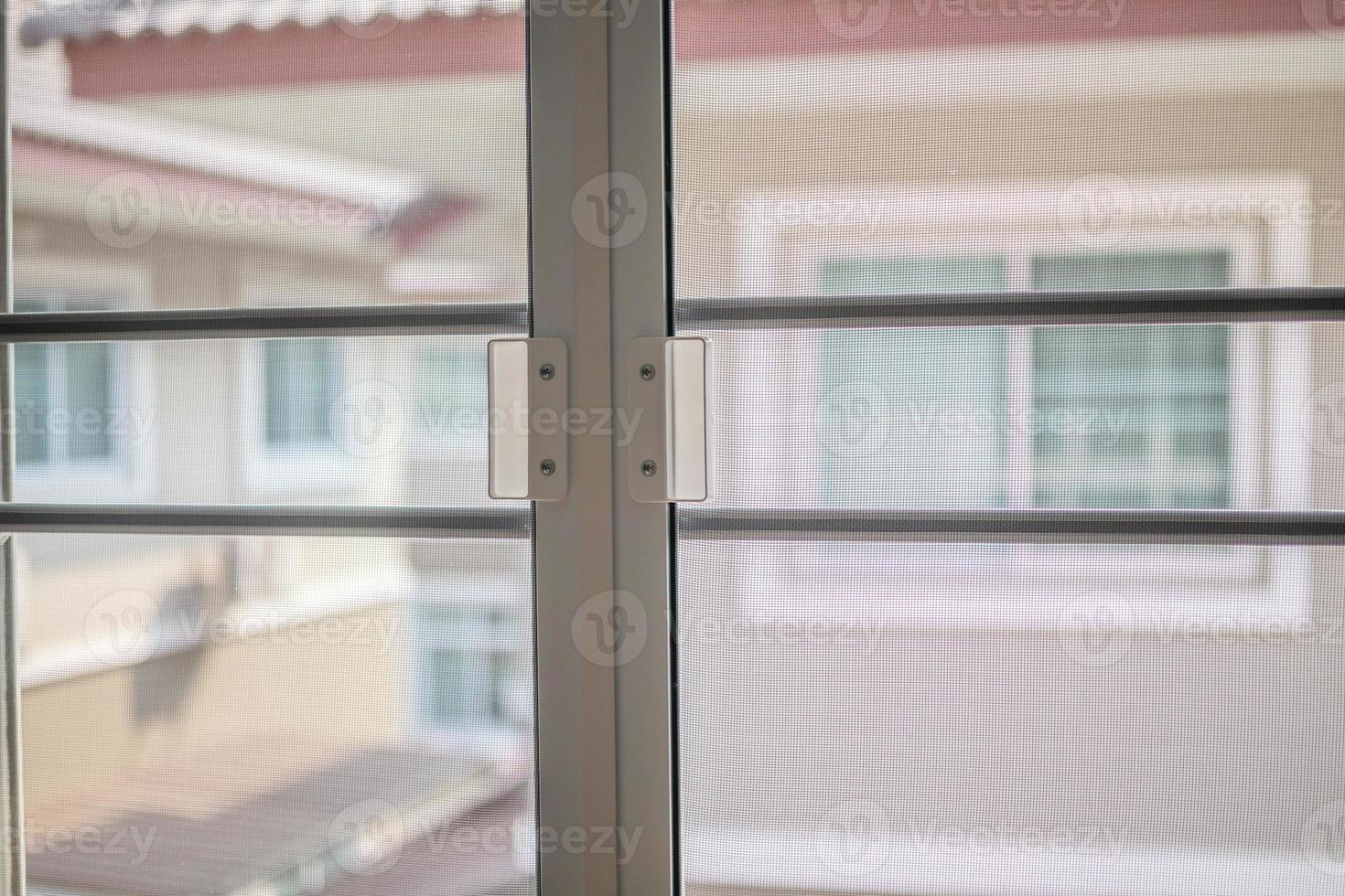 mosquito net wire screen on house window protection against insect photo