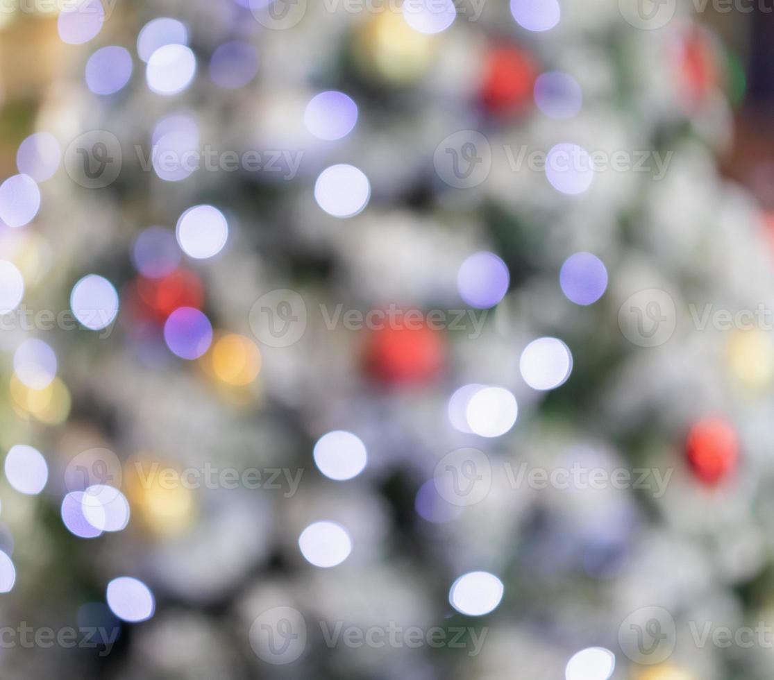 Abstract christmas holiday with festive gold bokeh light on tree blurred background photo