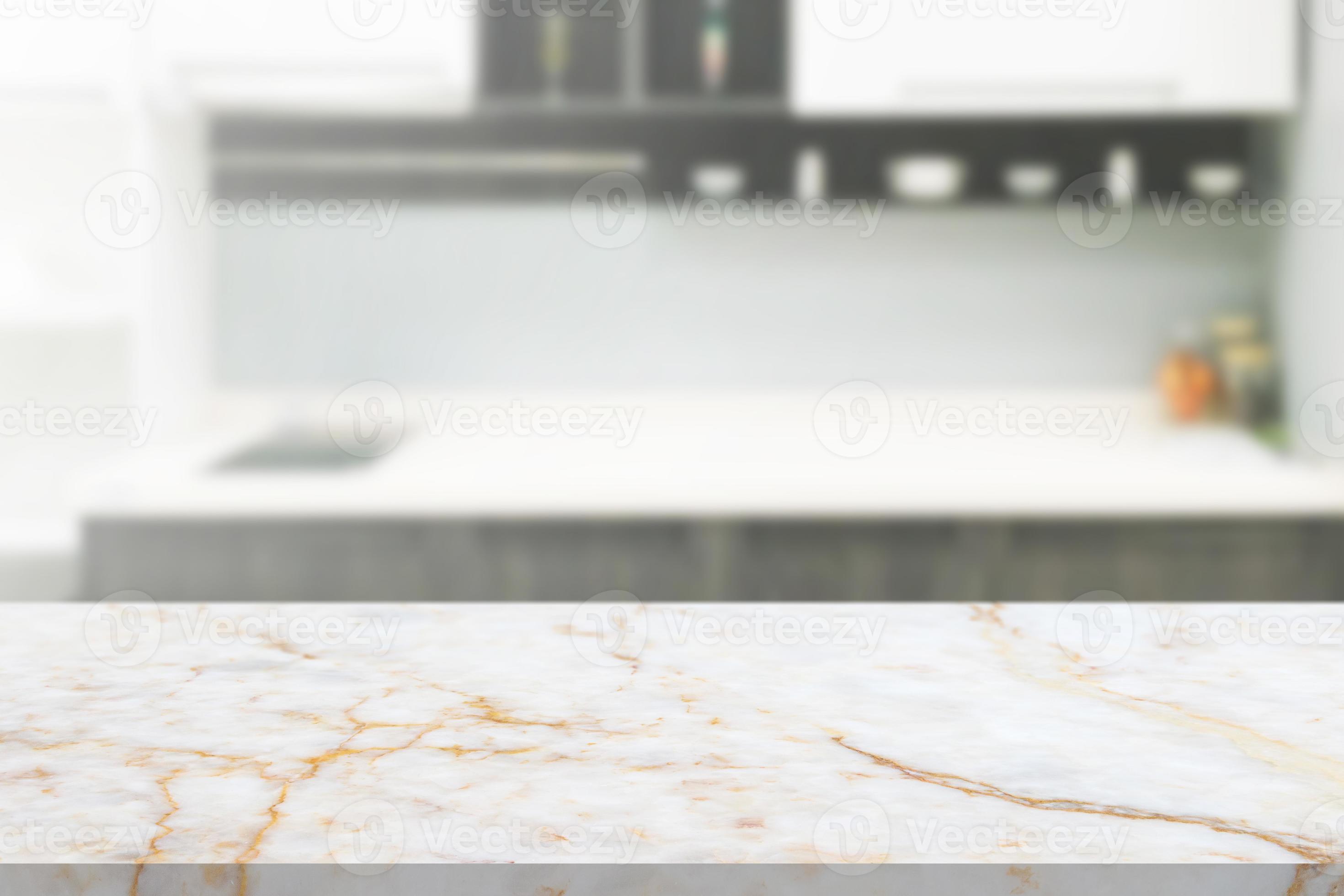 white marble stone counter top with blurred kitchen background 12909959