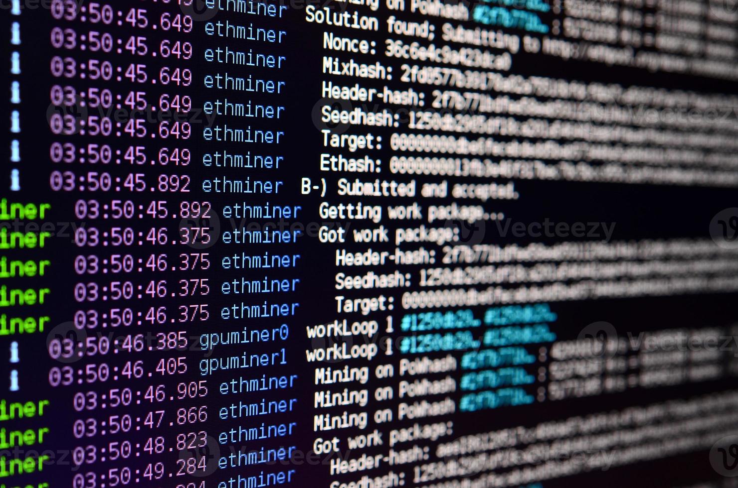 Macro snapshot of the program interface for crypto currency mining on the monitor of an office computer. The concept of mining bitcoins. The flow of information strings and data photo