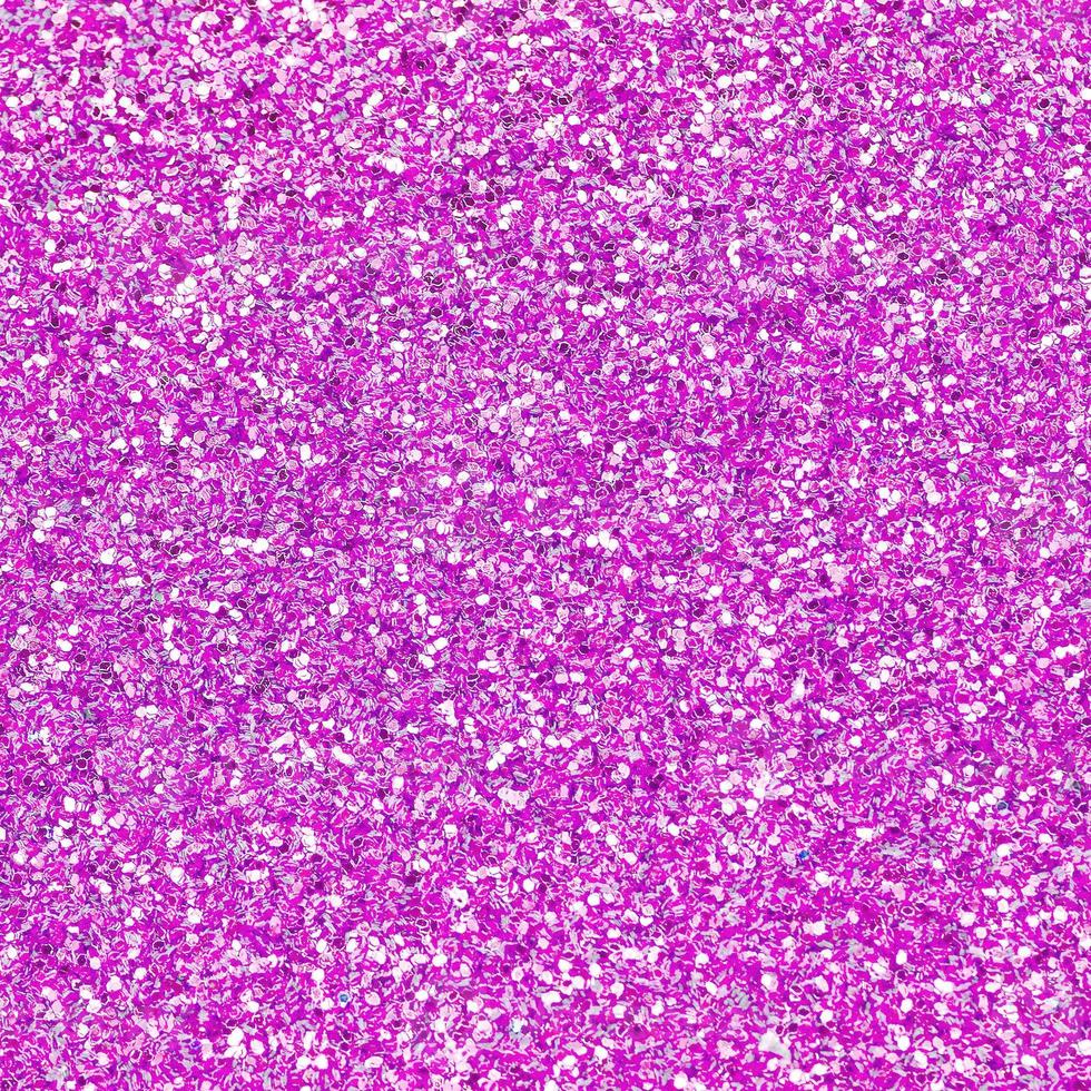 Pink decorative sequins. Background image with shiny bokeh lights from small elements photo