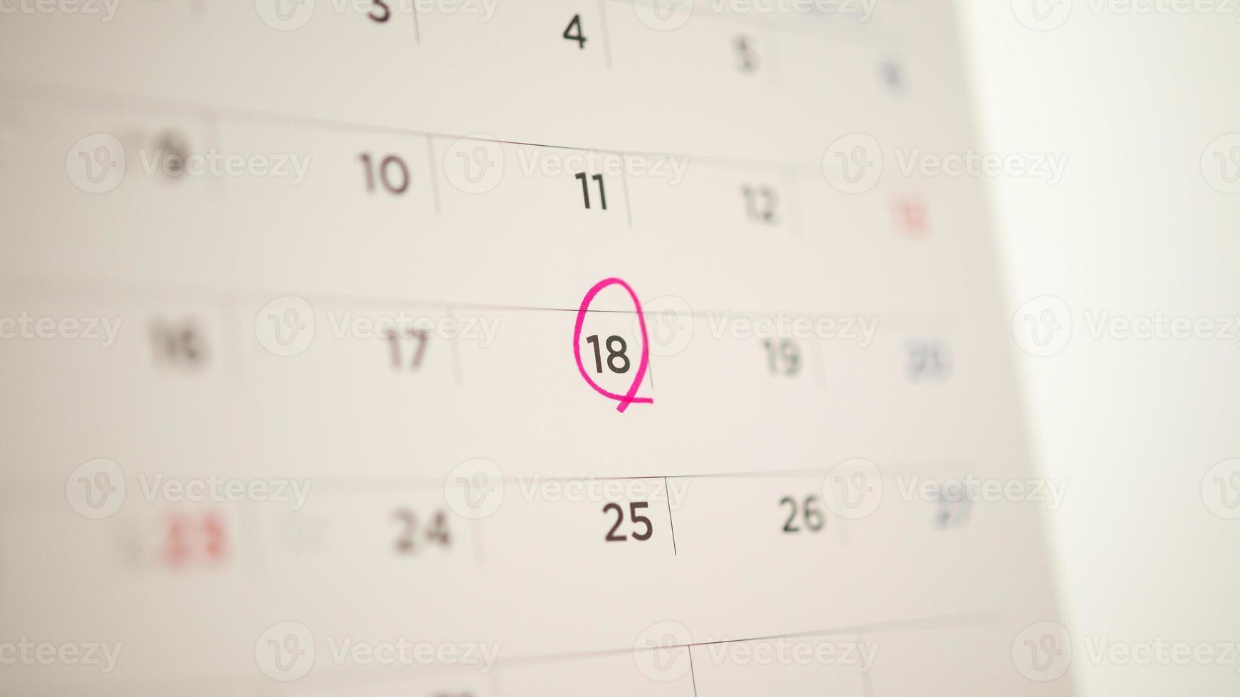 Red circle mark at 18th on calendar date business planning appointment meeting concept photo