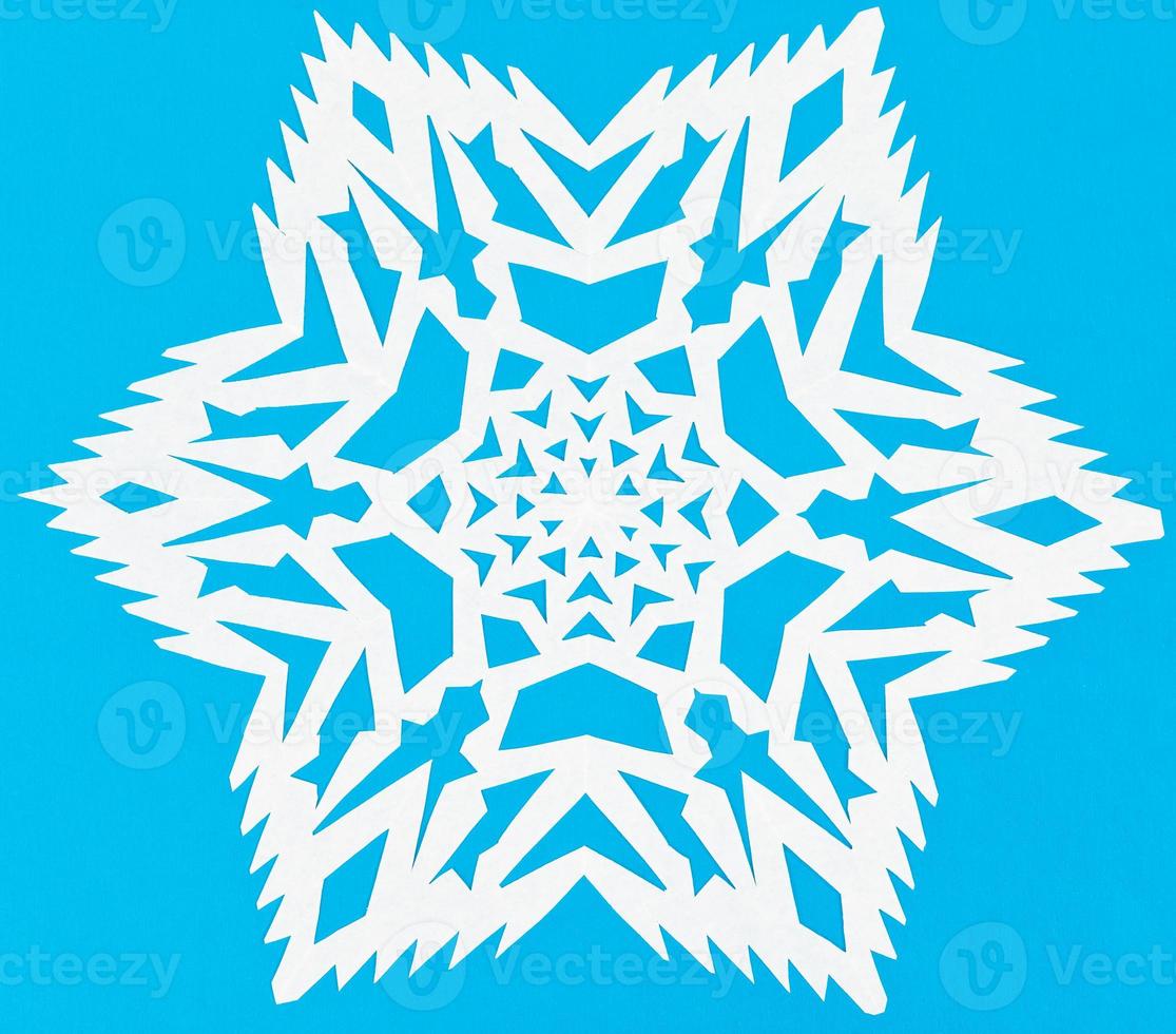 white snowflake on blue paper photo