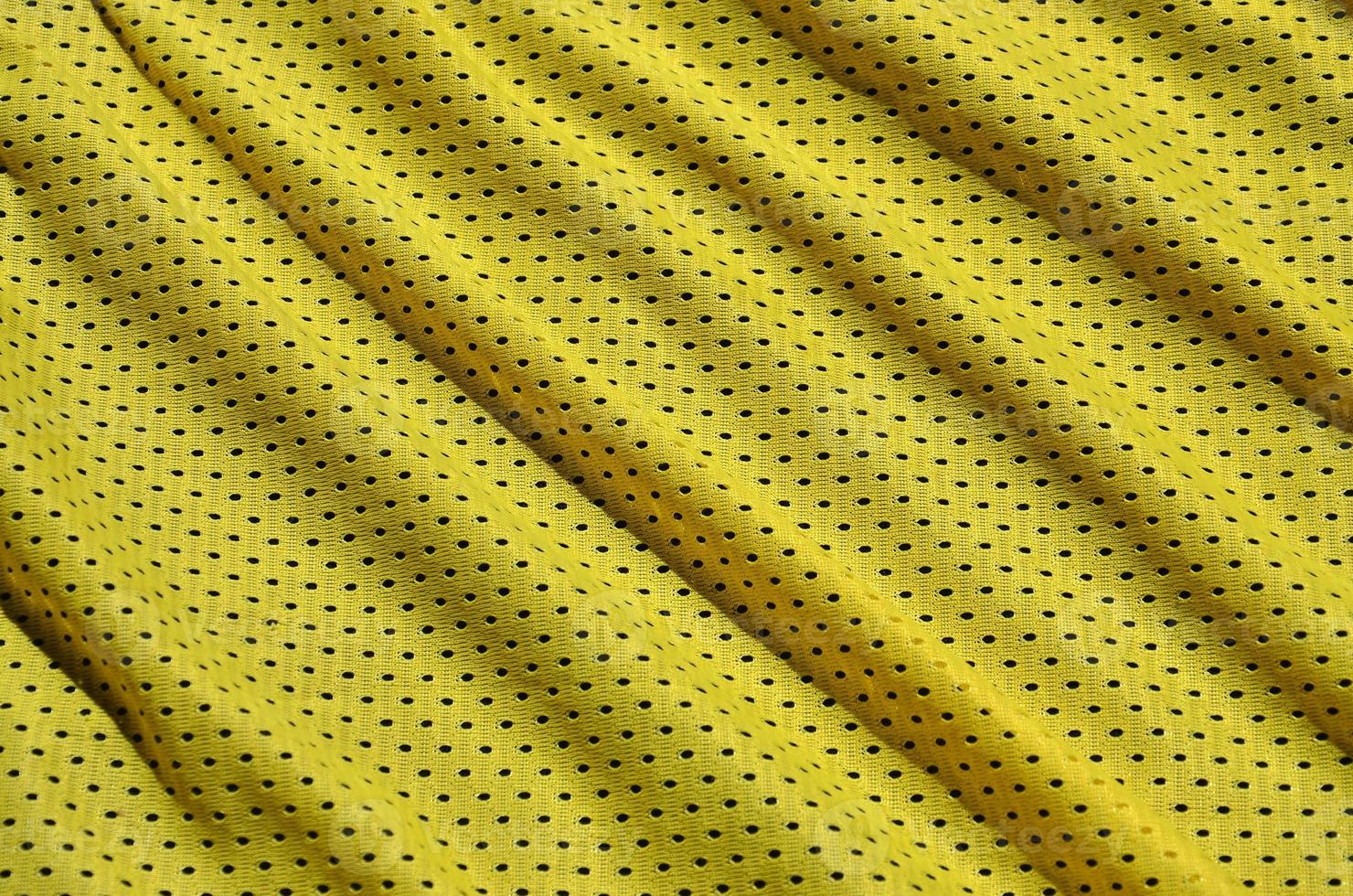 Texture of sportswear made of polyester fiber. Outerwear for sports training has a mesh texture of stretchable nylon fabric photo