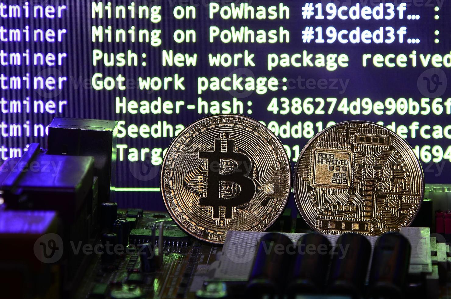 The digital process of cryptocurrency mining by using the GPUs. Bitcoins and video card on a working display and mining screen photo