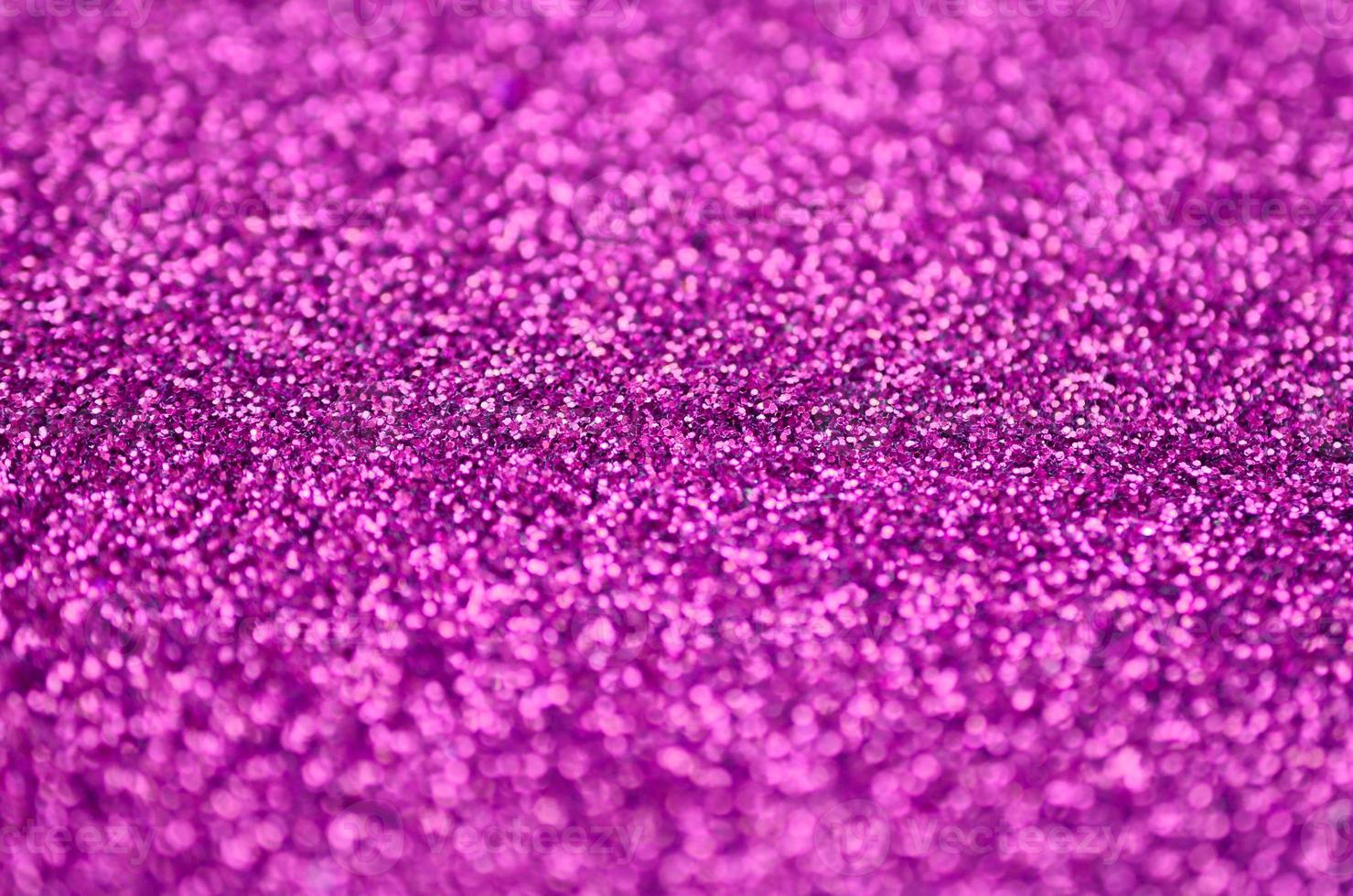 Pink decorative sequins. Background image with shiny bokeh lights from small elements photo