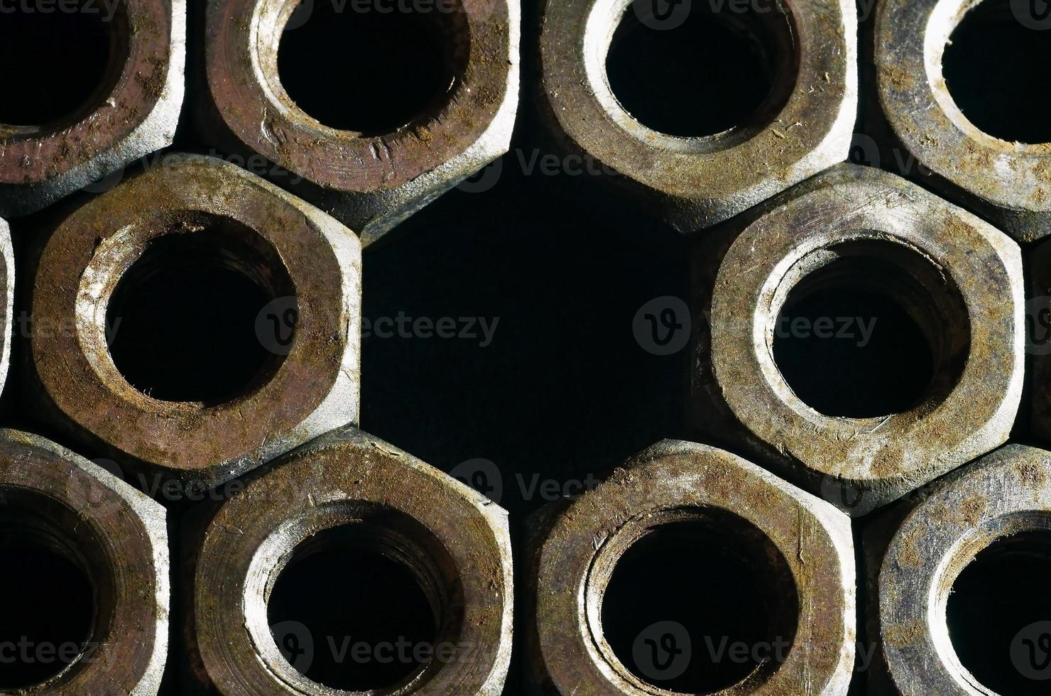 Close-up of rusty nuts photo