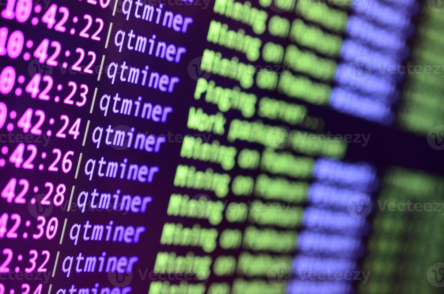 Macro snapshot of the program interface for crypto currency mining on the monitor of an office computer. The concept of mining bitcoins. The flow of information strings and data photo