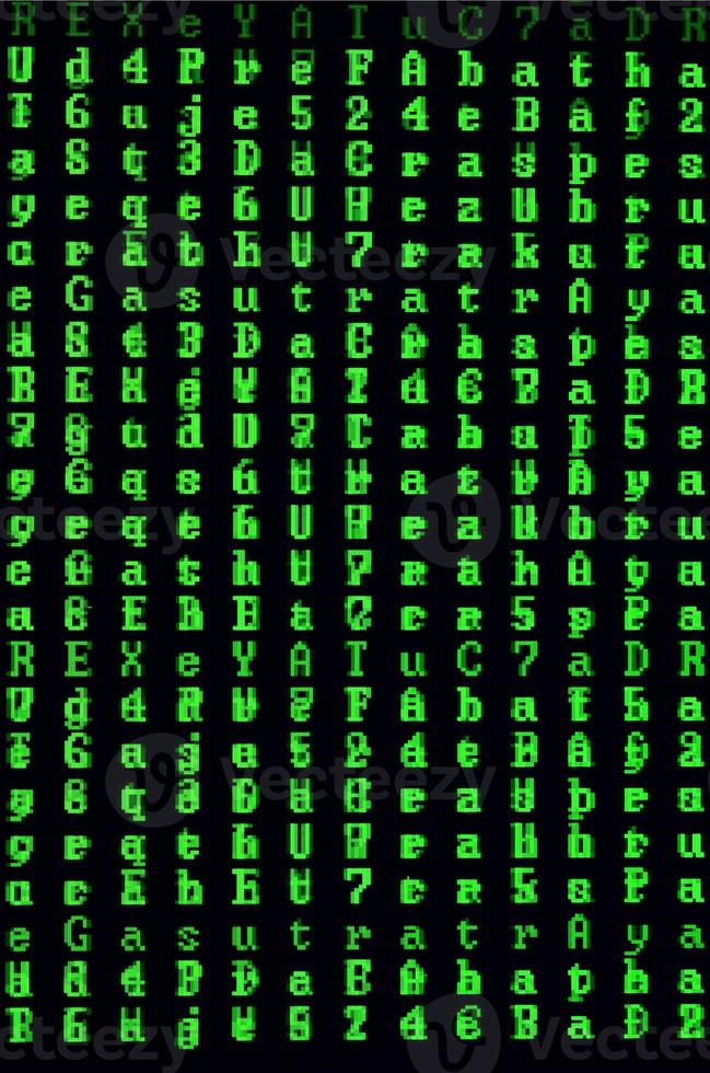 Macro shot of a glitch on the monitor of an office computer. The concept of introducing a virus into a personal data keeper. Stream of random green symbols on a black background photo
