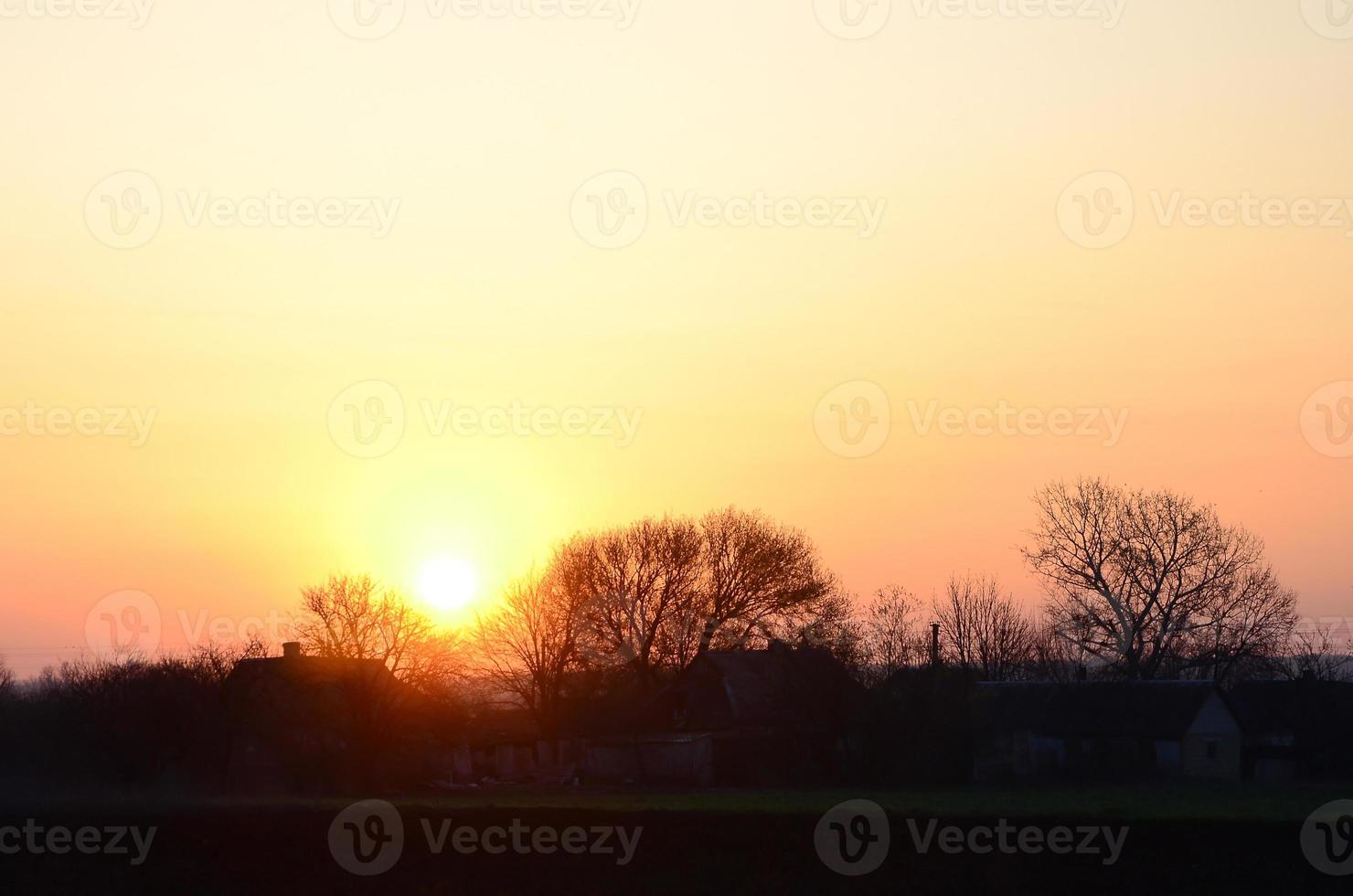 Dawn in the village. Sunrise in the suburban landscape photo