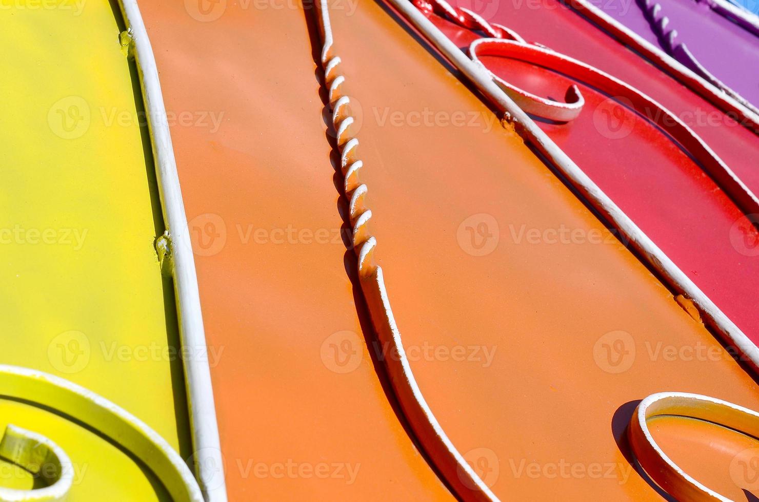 Metal texture of a piece of colored wall with a forged pattern photo
