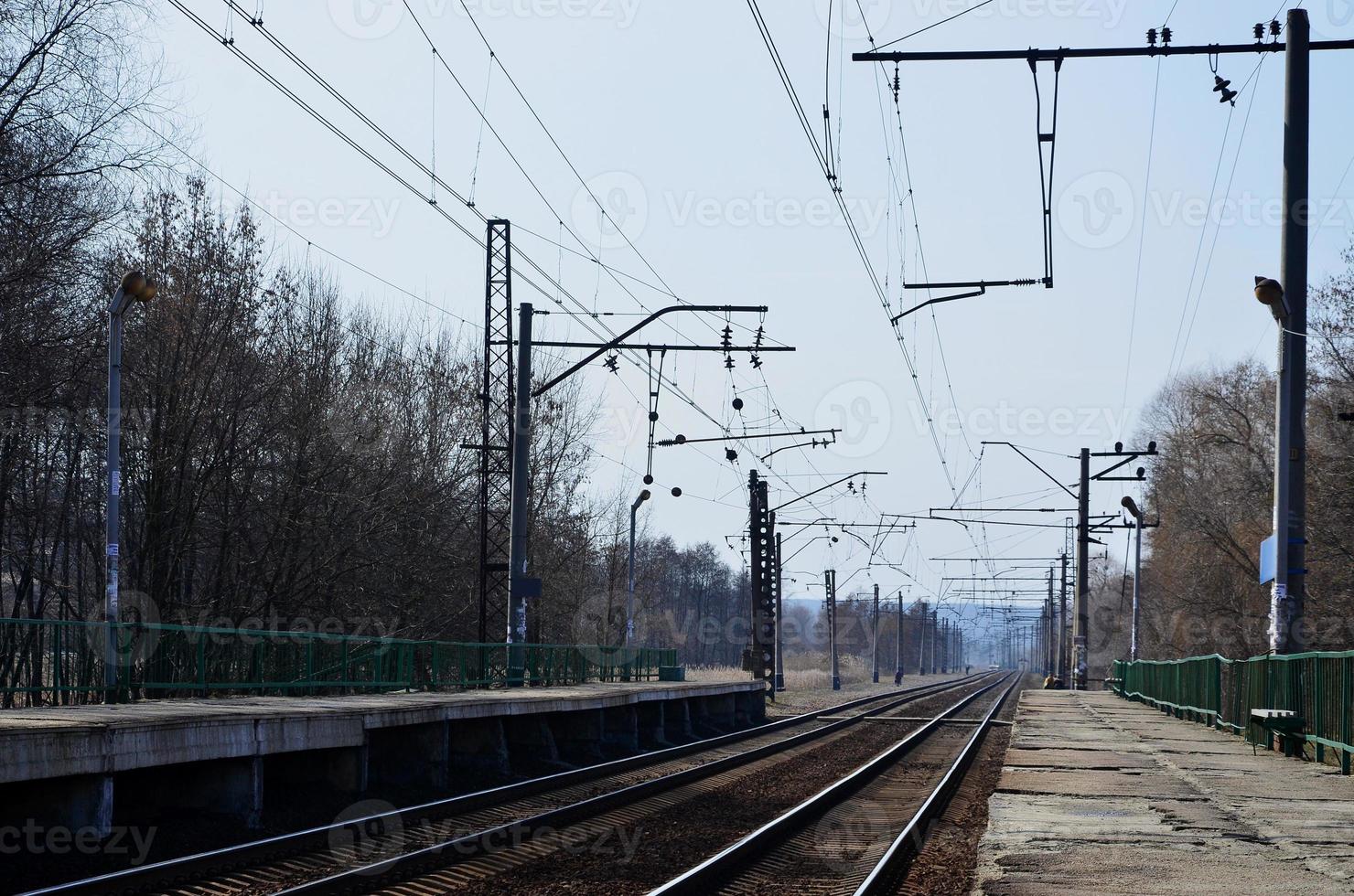 A railway station with platforms for waiting for trains photo