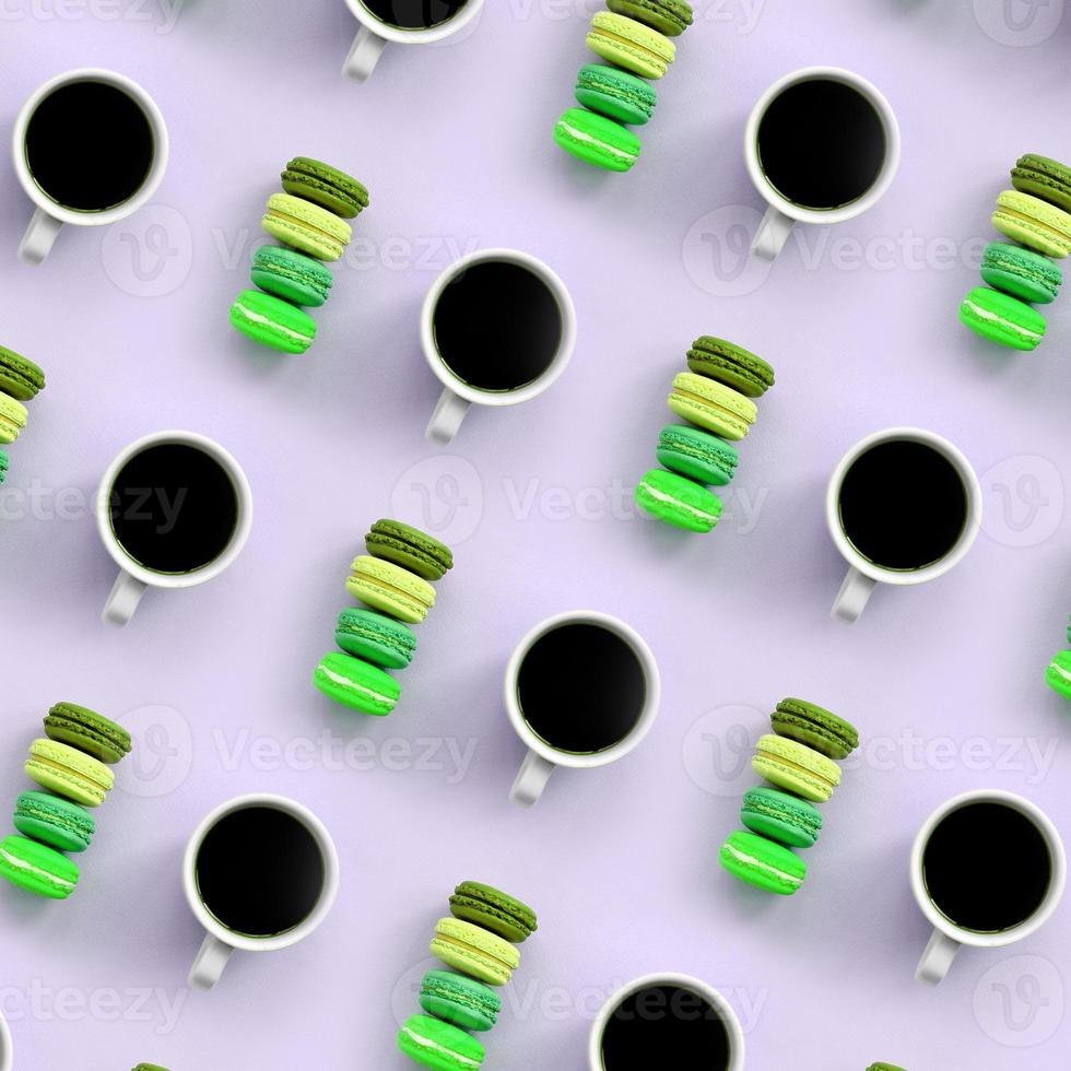A pattern of many colorful dessert cake macaroon and coffee cups on trendy pastel lilac background top view photo
