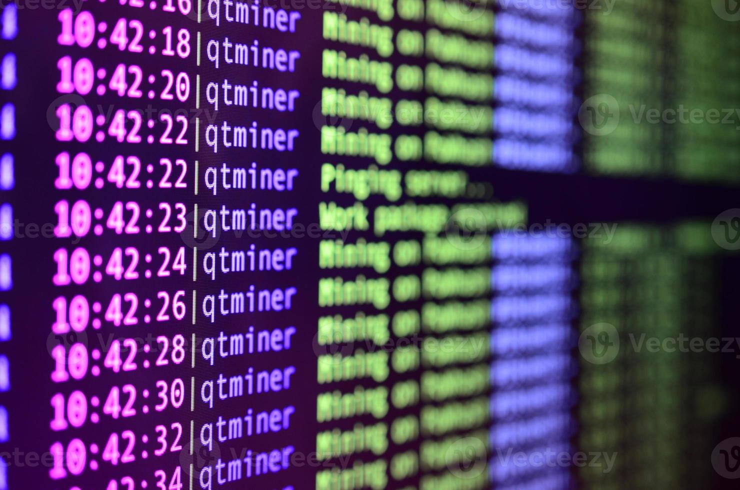 Macro snapshot of the program interface for crypto currency mining on the monitor of an office computer. The concept of mining bitcoins. The flow of information strings and data photo