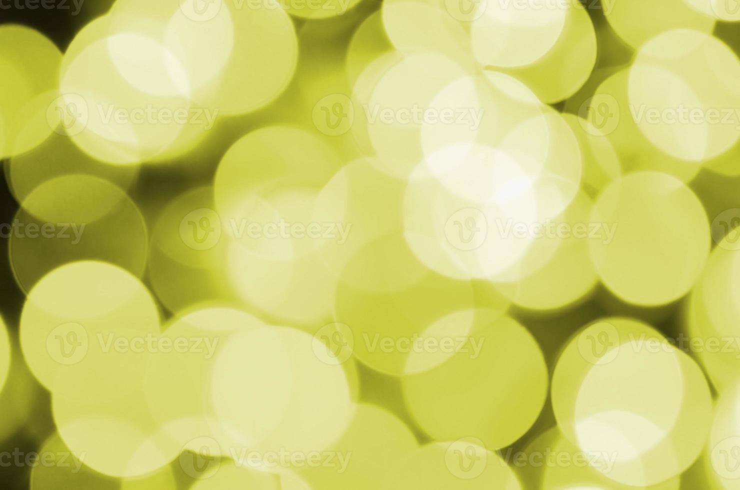 Bokeh effect golden yellow defocused light background. Christmas Lights Concept photo