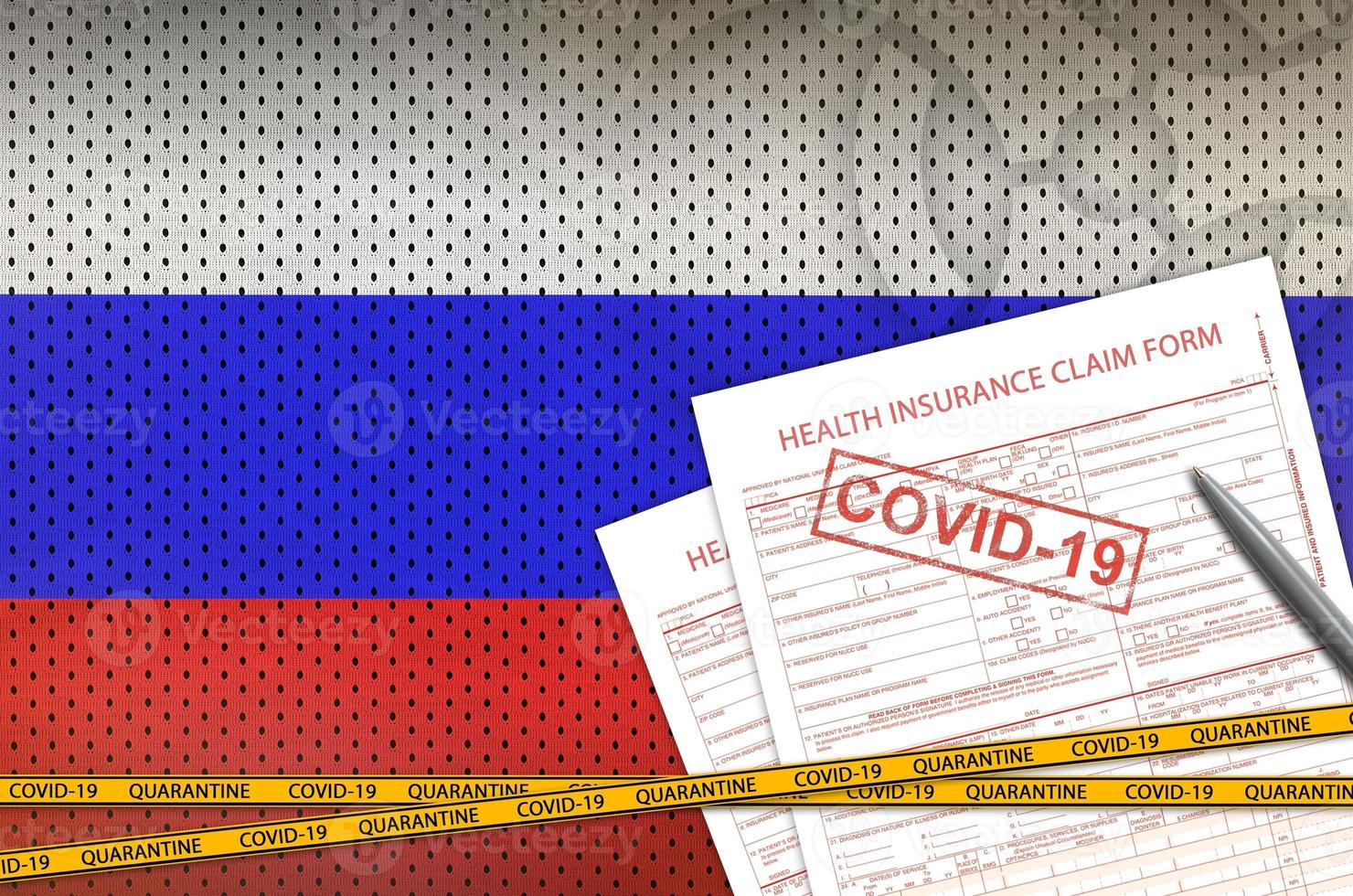 Russia flag and Health insurance claim form with covid-19 stamp. Coronavirus or 2019-nCov virus concept photo