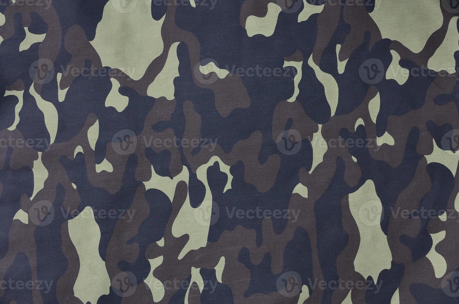 Textile pattern of military camouflage fabric photo