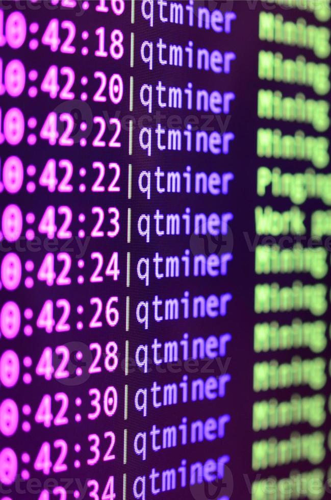 Macro snapshot of the program interface for crypto currency mining on the monitor of an office computer. The concept of mining bitcoins. The flow of information strings and data photo