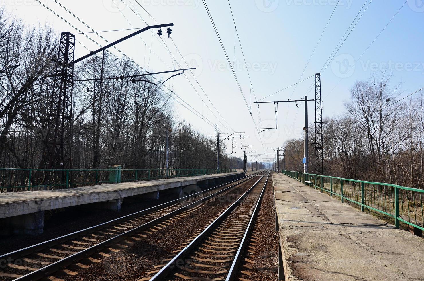 A railway station with platforms for waiting for trains photo