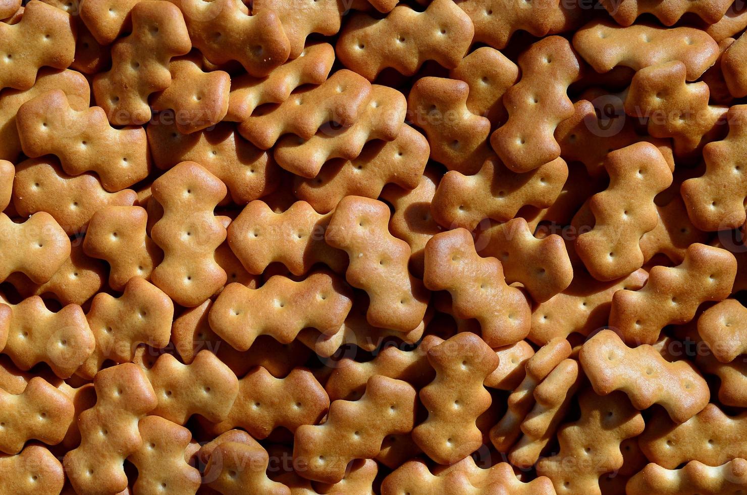 Pattern of a many yellow salted crackers photo