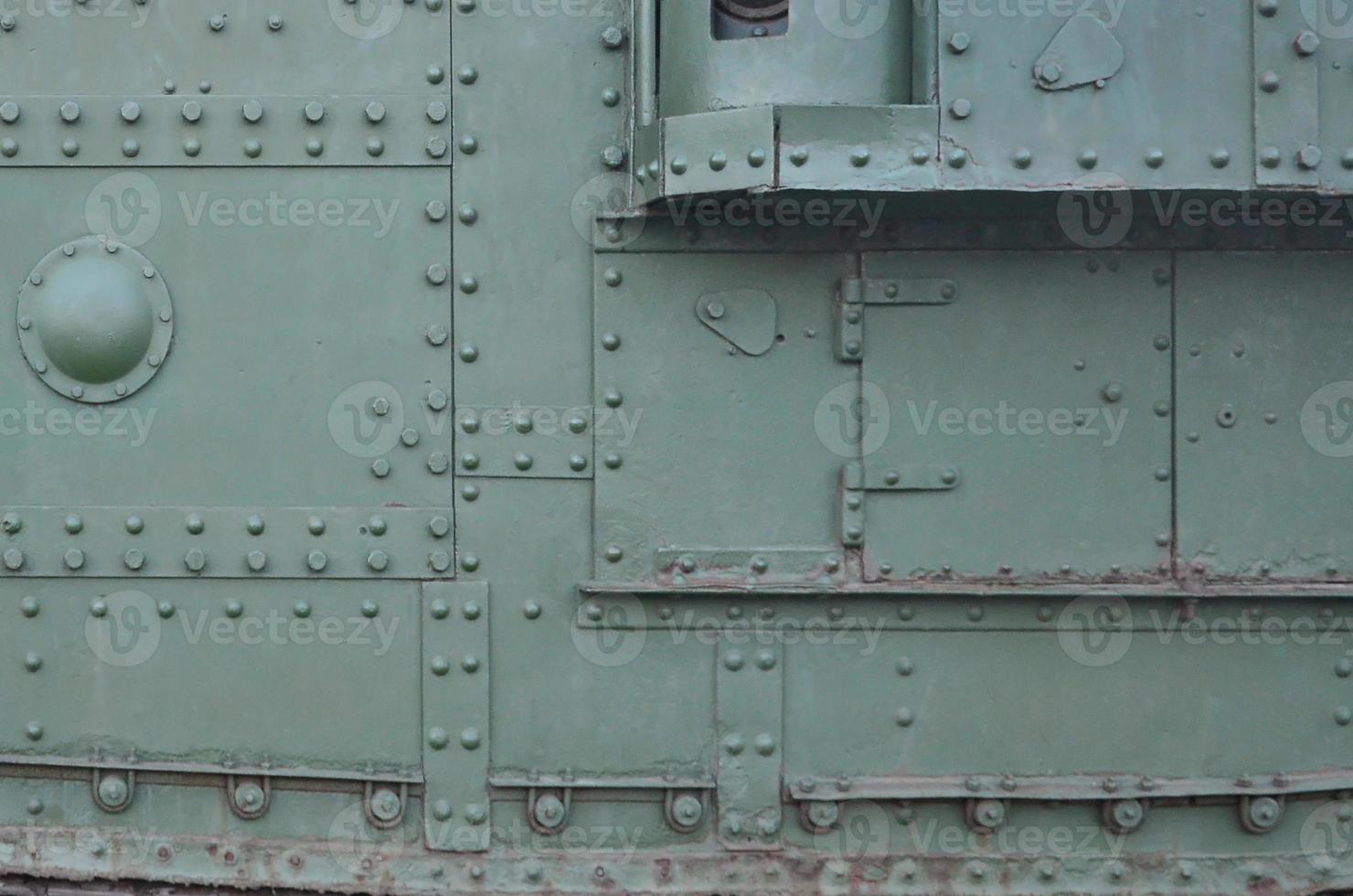 Abstract green industrial metal textured background with rivets and bolts photo