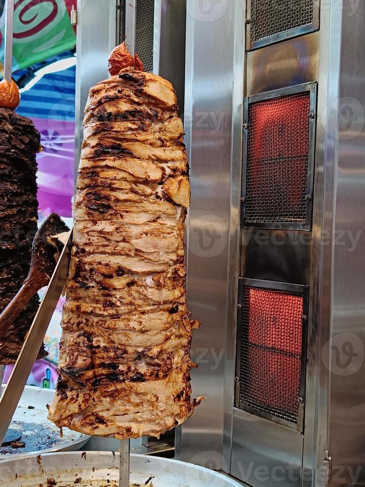 Hot grilled meat on the stove for making kebabs in the market at Thailand. photo