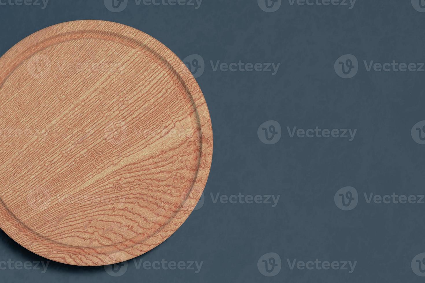 Round cutting board top view on dark background with empty space. photo