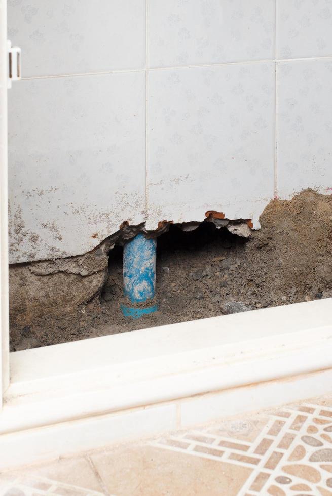 Concrete walls in the shade that have been smashed or destroyed to find holes for water leaks. Home repair concept. photo