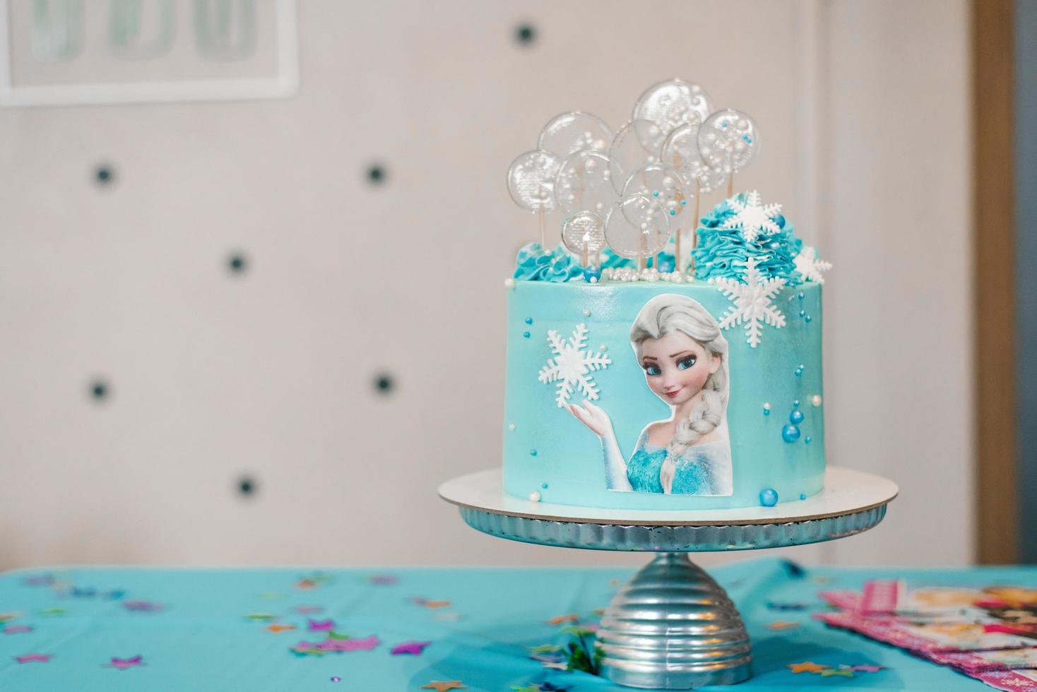 Moscow, Russia. May 2021. Children's birthday cake in the style of a Frozen heart with Elsa photo