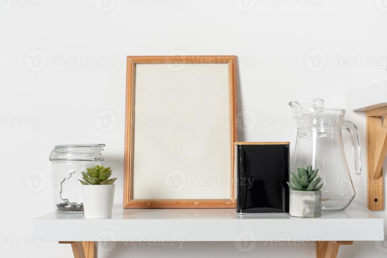 Wooden vertical frame with kitchen decor over white wall photo
