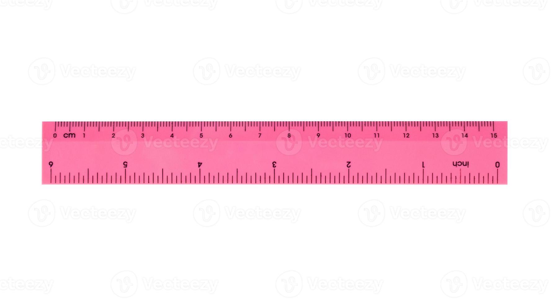 Pink plastic ruler isolated on white background photo