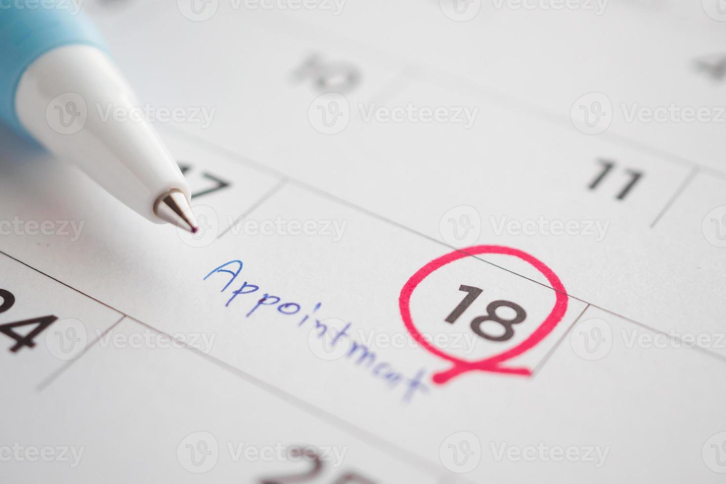 important appointment schedule write on white calendar page date close up photo