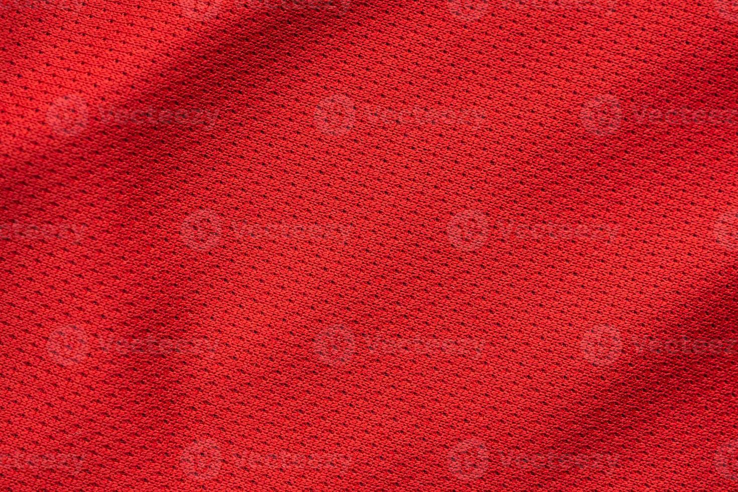 Red sports clothing fabric football jersey texture close up photo