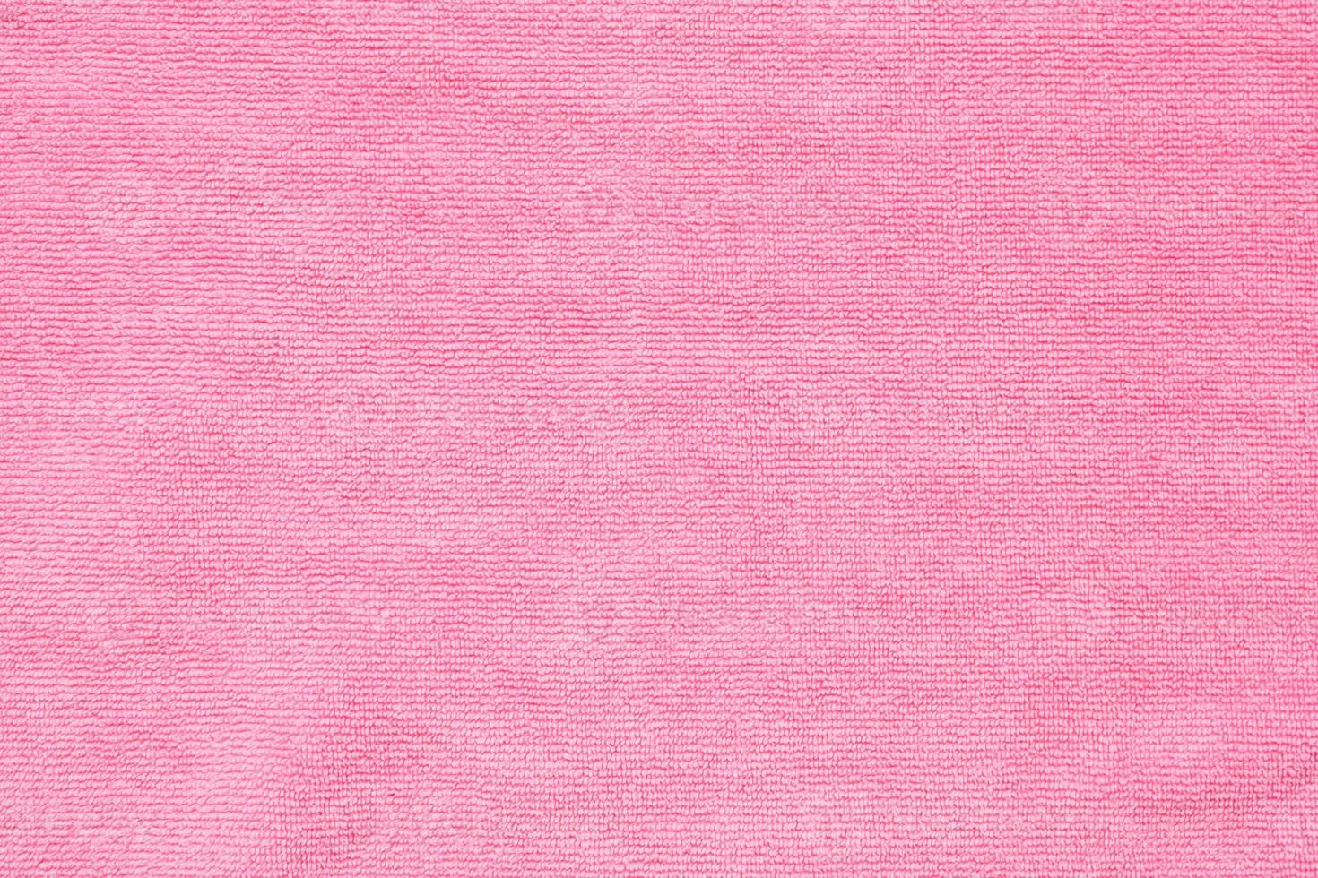 Pink towel fabric texture surface close up background photo