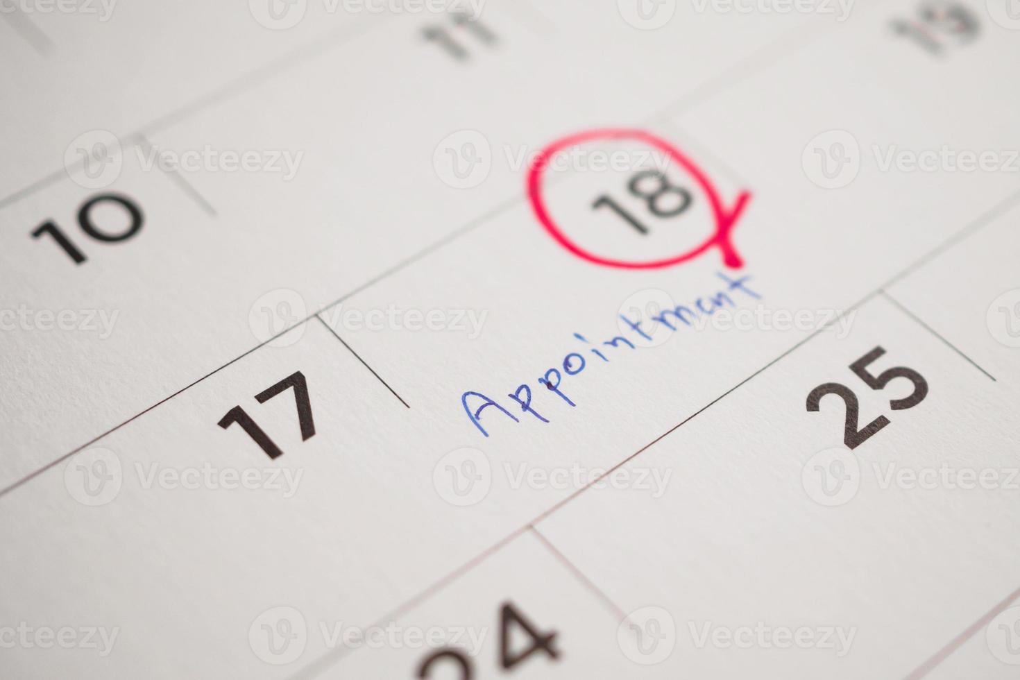 important appointment schedule write on white calendar page date close up photo