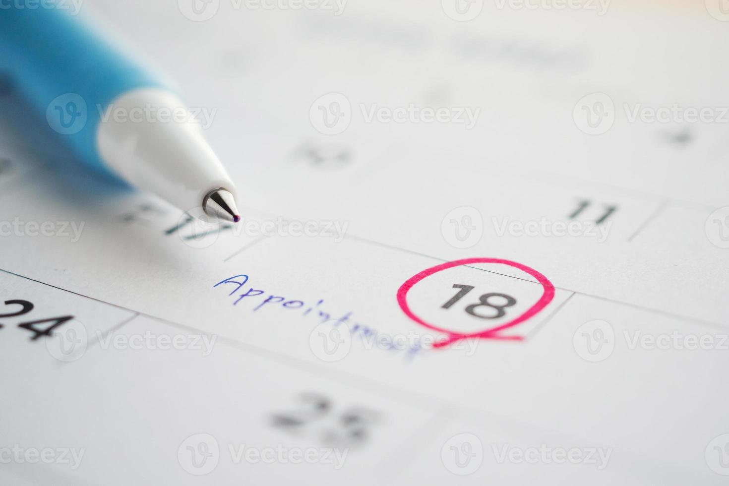 important appointment schedule write on white calendar page date close up photo