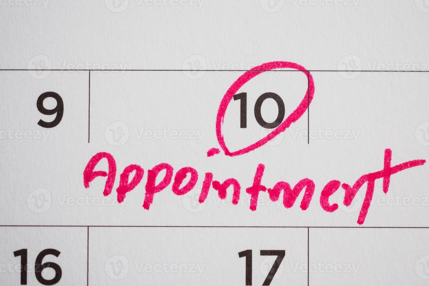 important appointment schedule write on white calendar page date close up photo