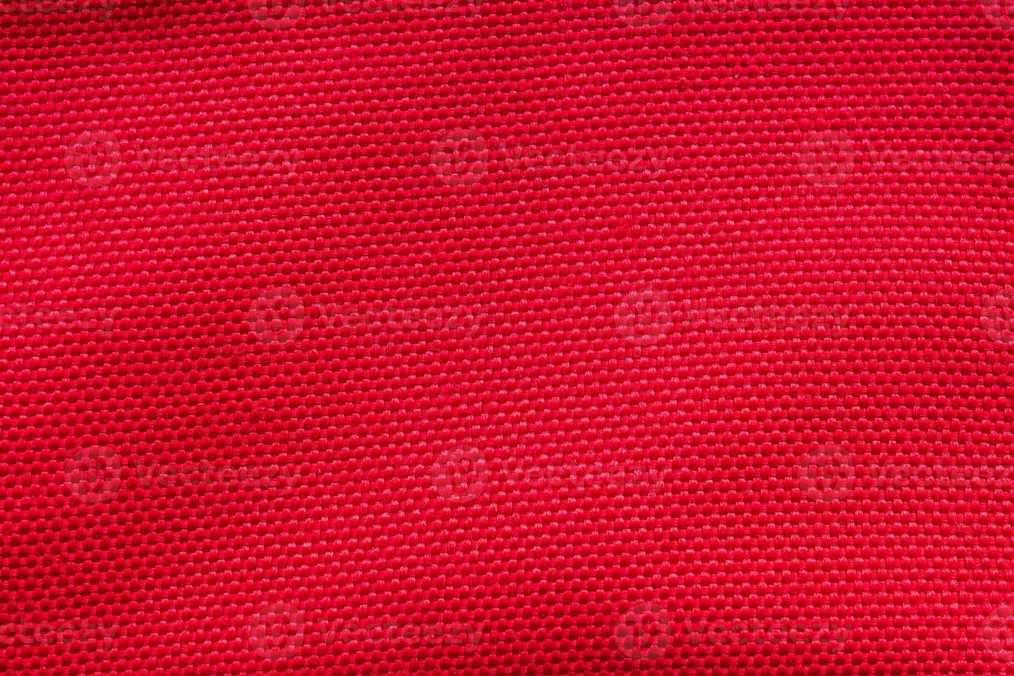 Red fabric cloth texture background close up photo