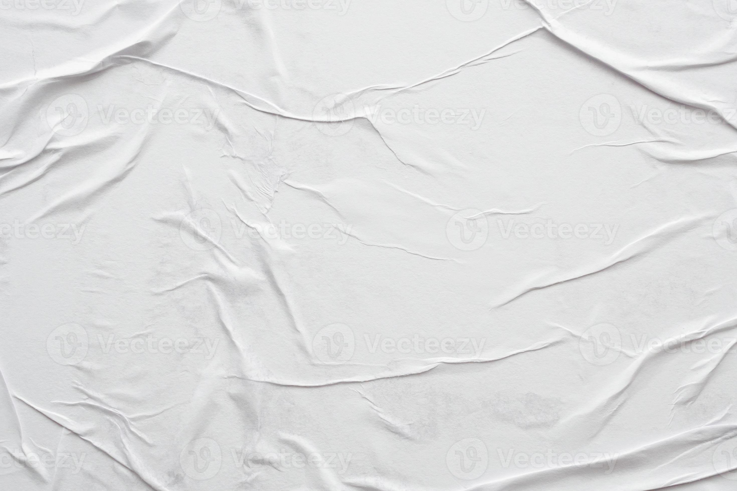 Blank white crumpled and creased paper poster texture background