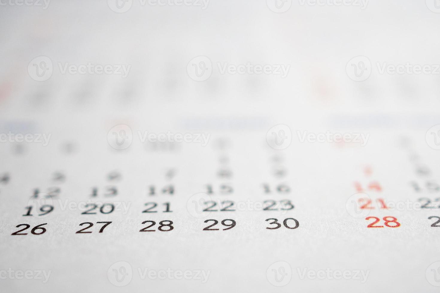 Close up calendar page dates abstract blurred background business planning appointment meeting concept photo