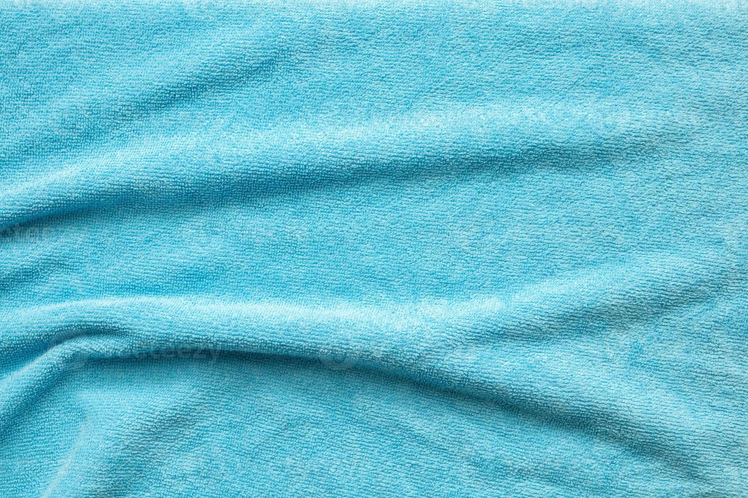 Blue towel fabric texture surface close up background photo