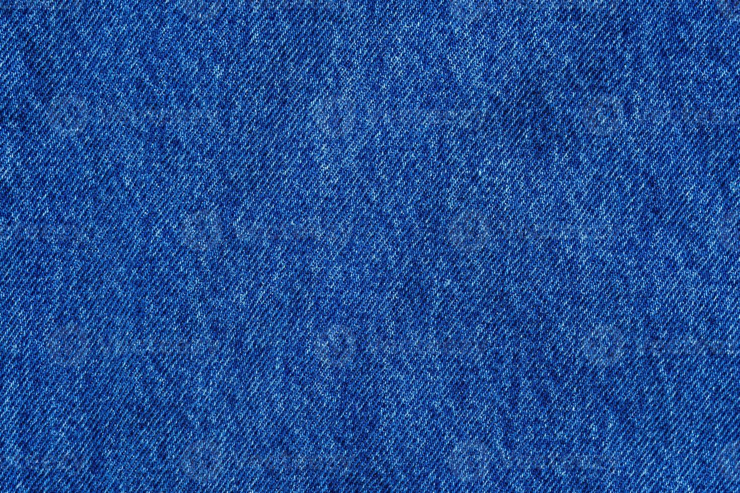 Denim blue jeans texture close up background top view photo