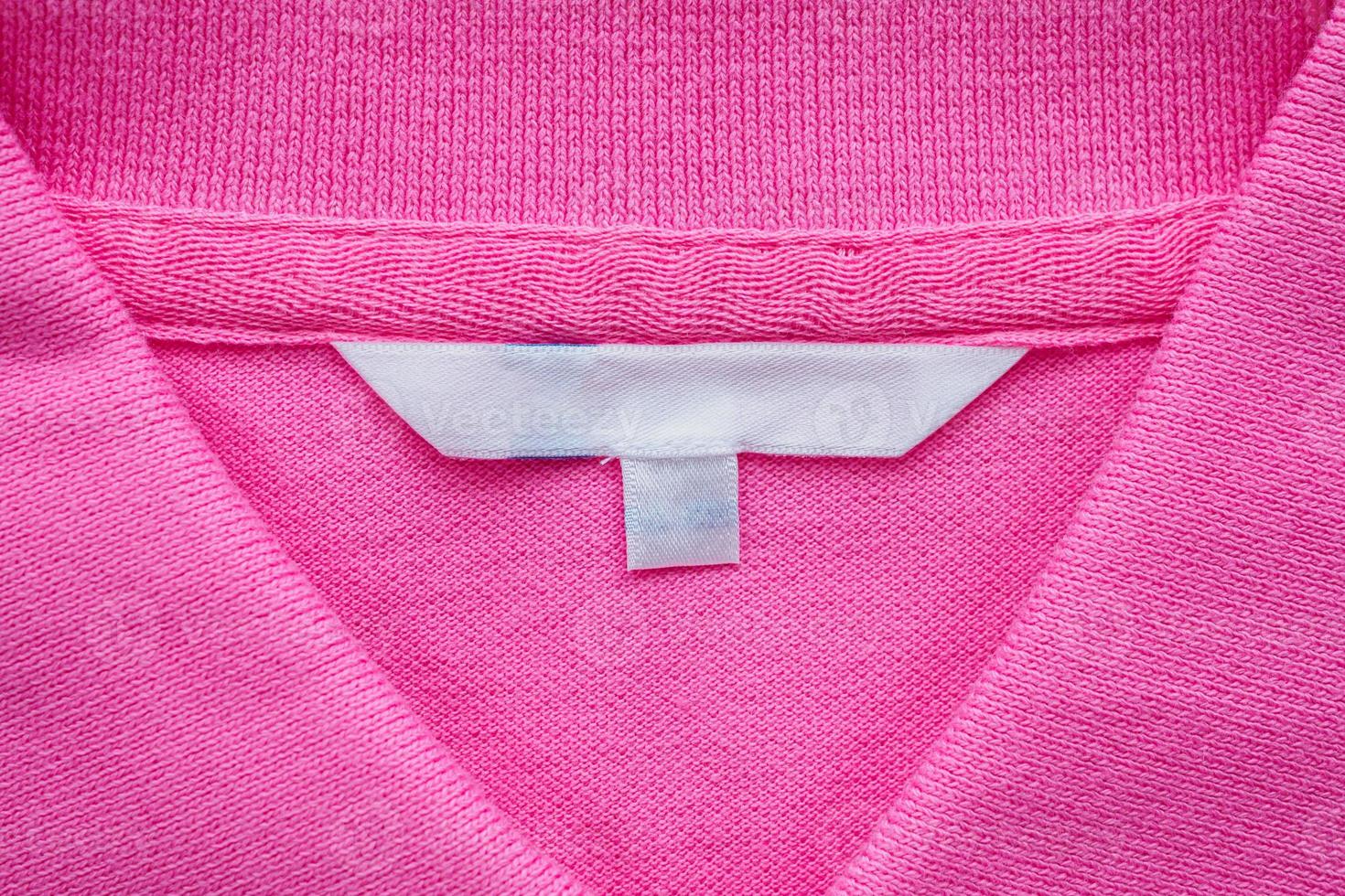 Blank white clothes label on new shirt photo