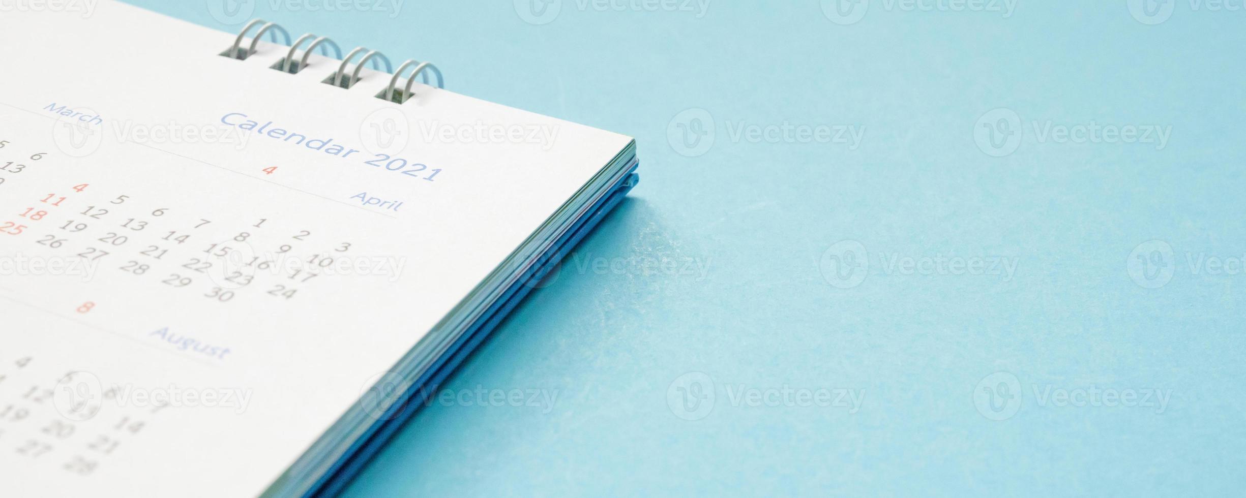 2021 calendar page on blue background business planning appointment meeting concept photo