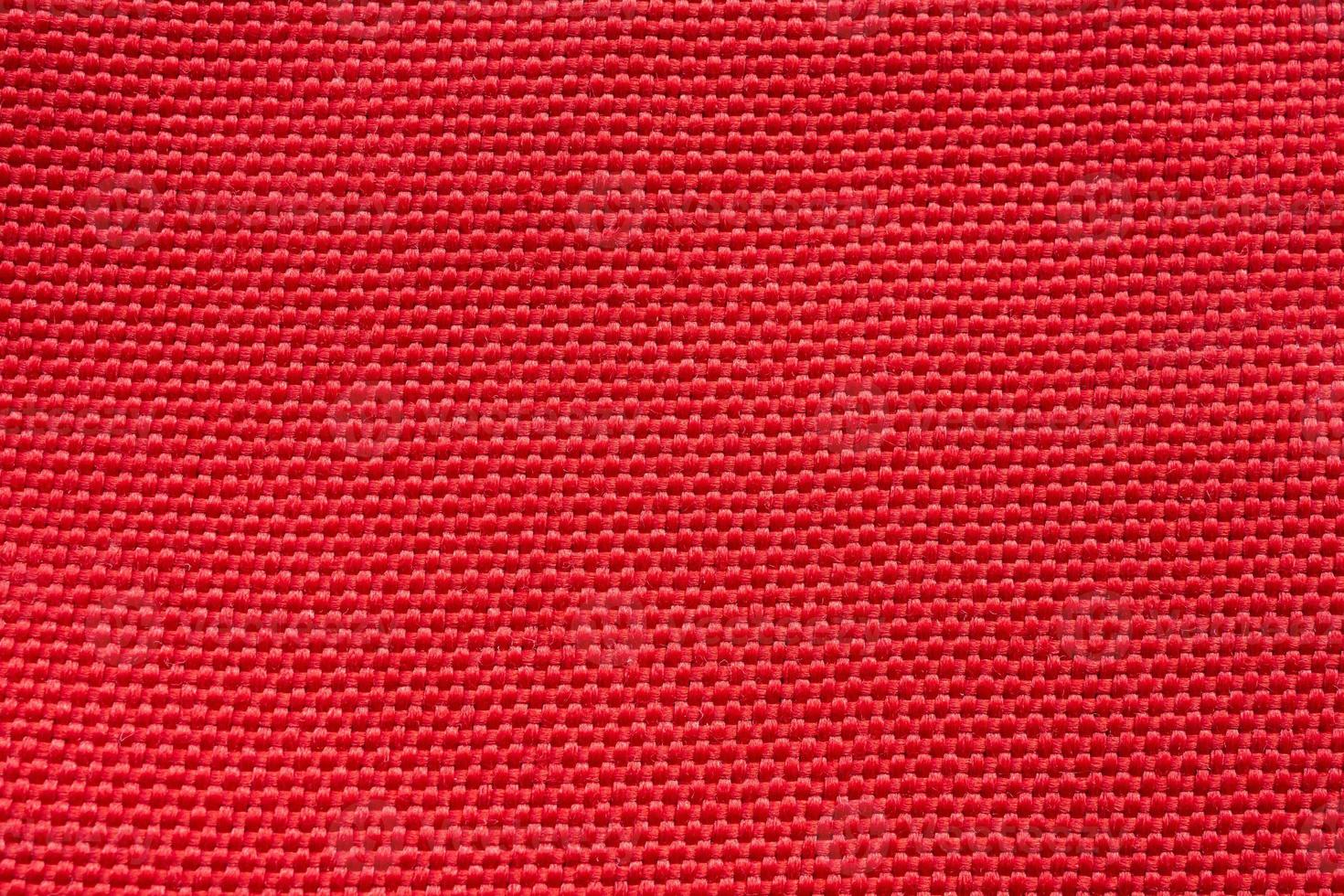 Red fabric cloth texture background close up photo