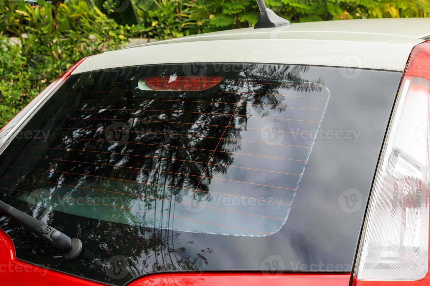 Back view of red car window for sticker mockup photo