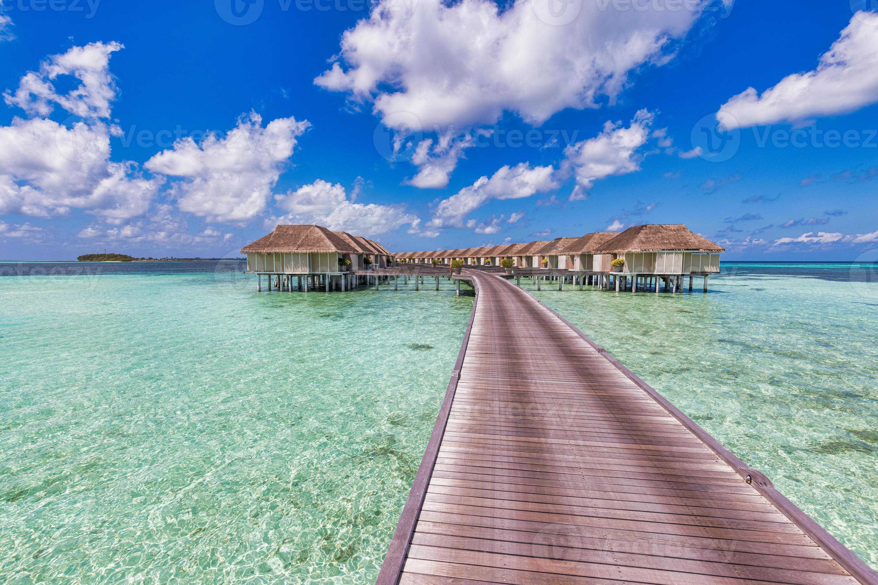 Beautiful Maldives water villa in blue lagoon and blue sky space ...