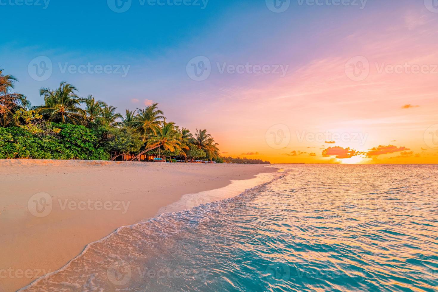 Landscape of paradise tropical island beach. Silhouette palm trees beautiful sunset sky, dream sea beach background. Tranquil travel holiday relax tourism. Closeup view of waves sunrise seaside nature photo